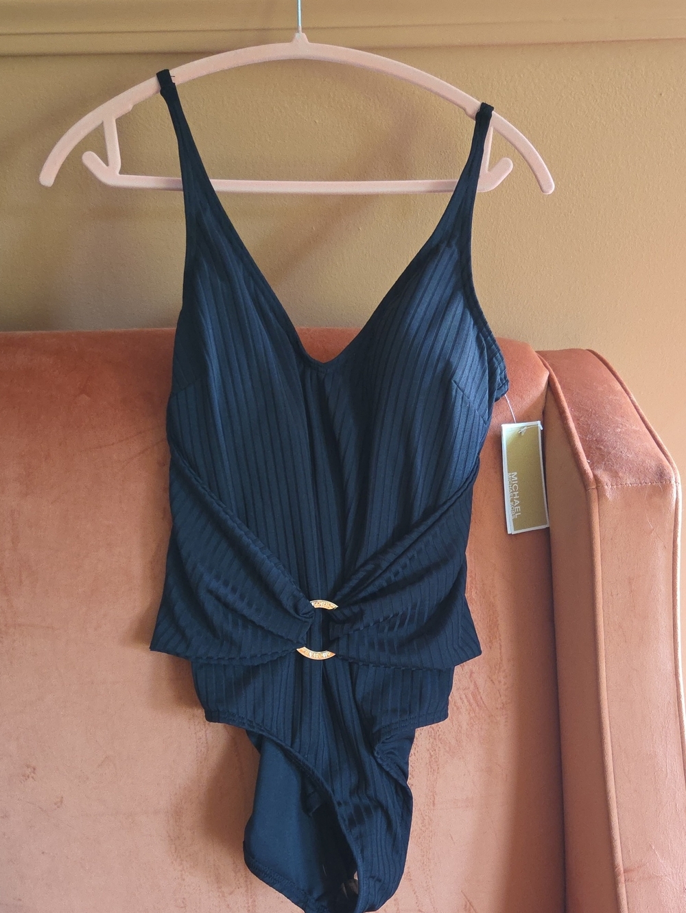 Michael Kors Black Ribbed One-Piece Bodysuit with Gold-Tone Rings